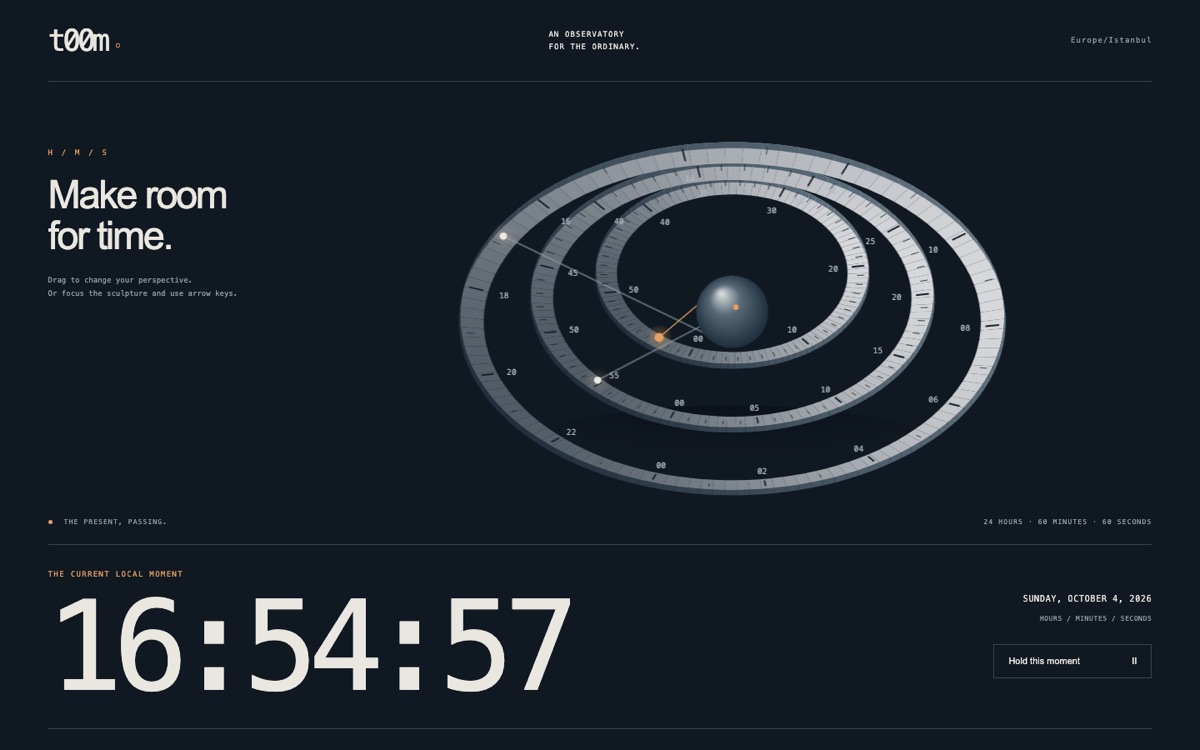 Three tilted rings for hours, minutes and seconds around a small sphere, above a large readout of the current local time.